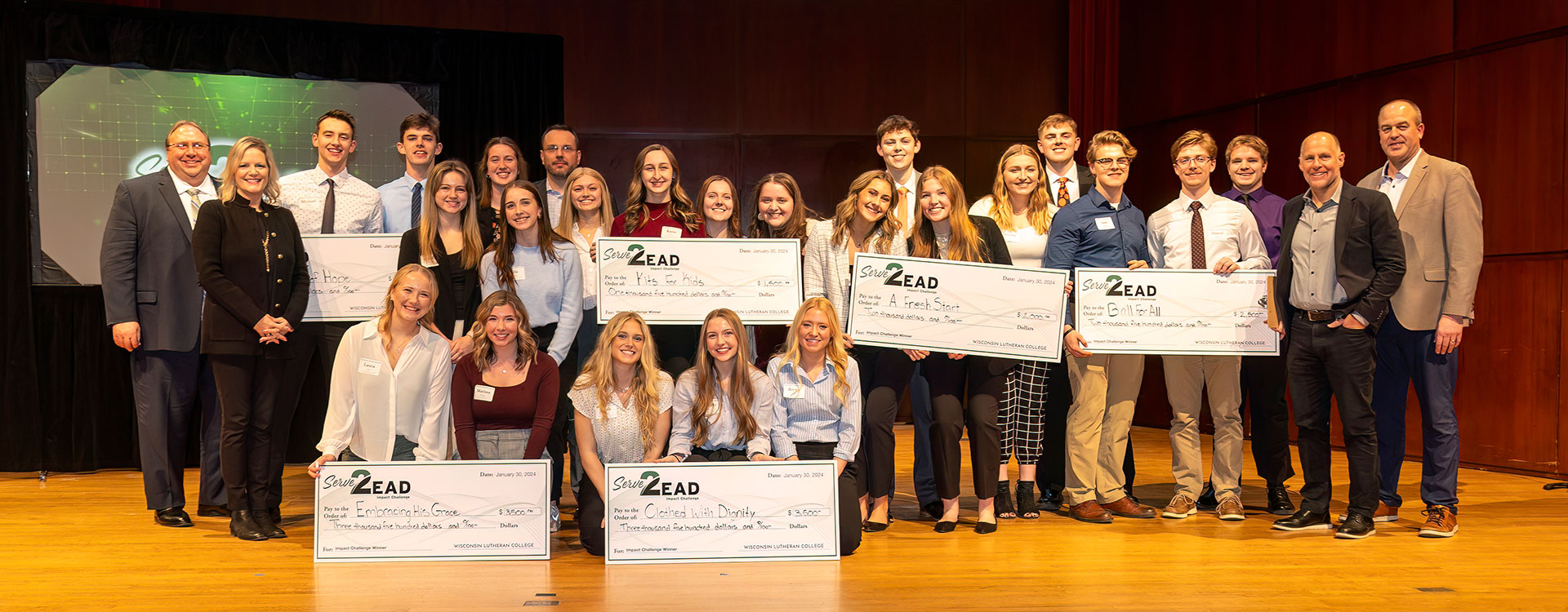 Serve2Lead winners on Schwan Concert Hall stage with big check