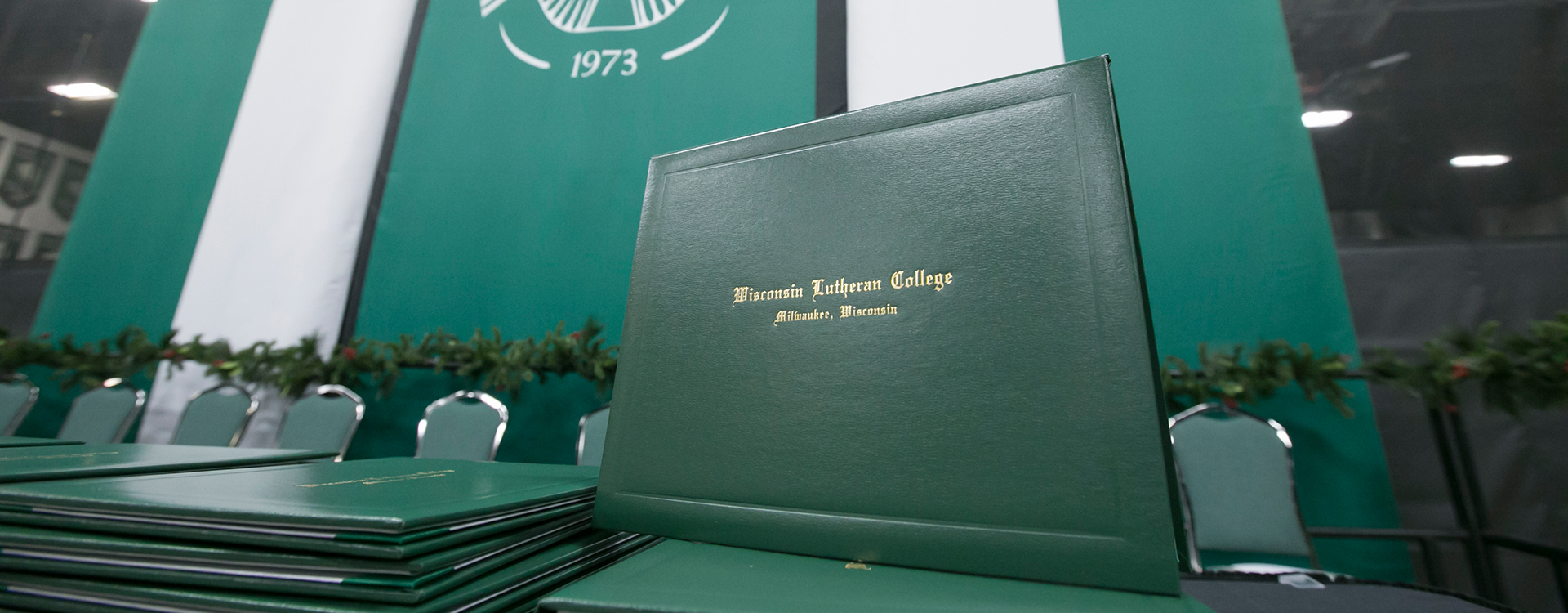 Diplomas on stage at commencement