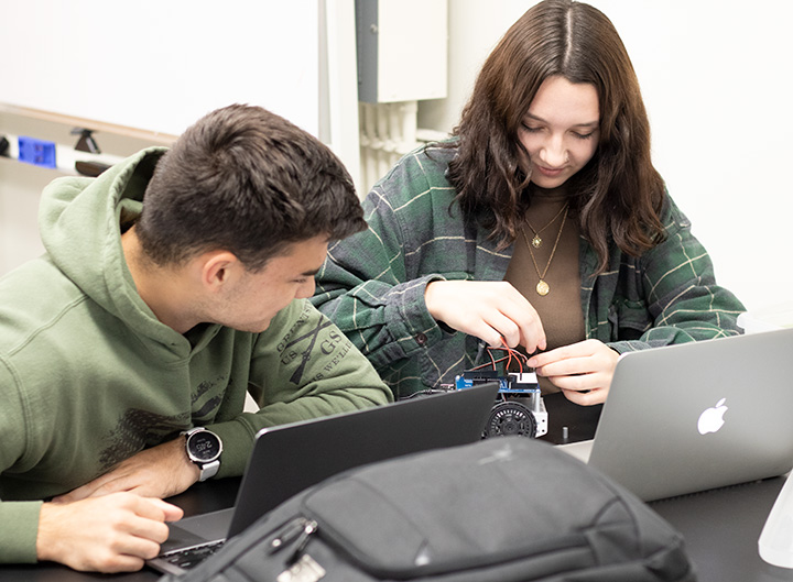 Male and female student in Makerspace for robotics course
