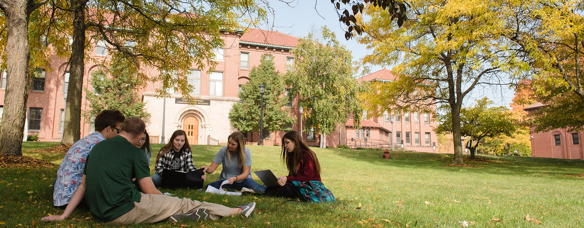 Students studying in the grass on WLC campus