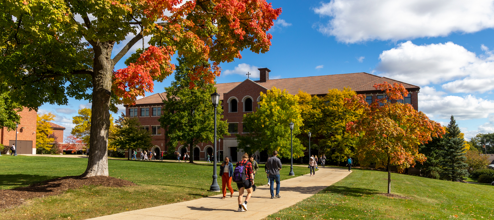 Students outside Generac Hall in fall