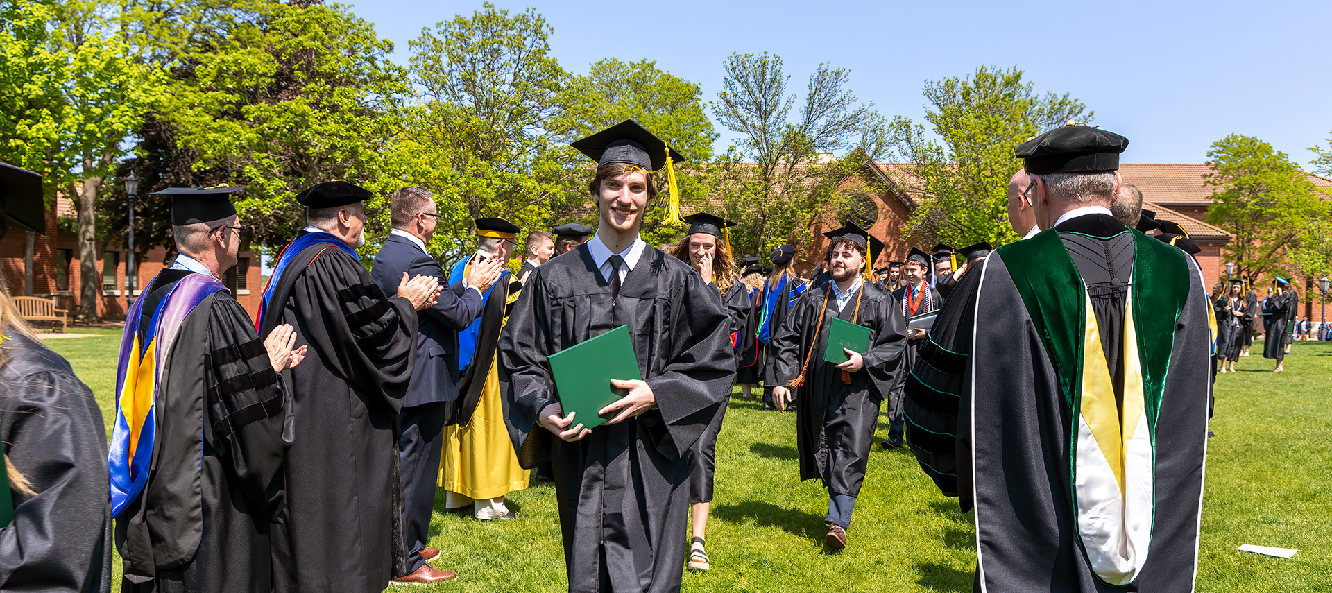 2023 grad with diploma