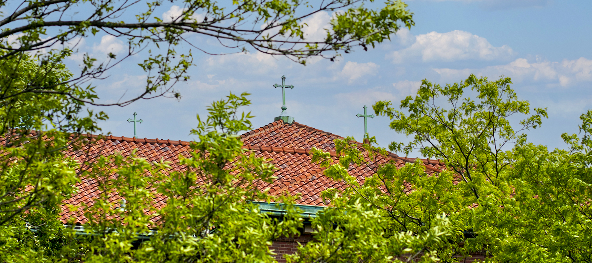 Three crosses on top of building