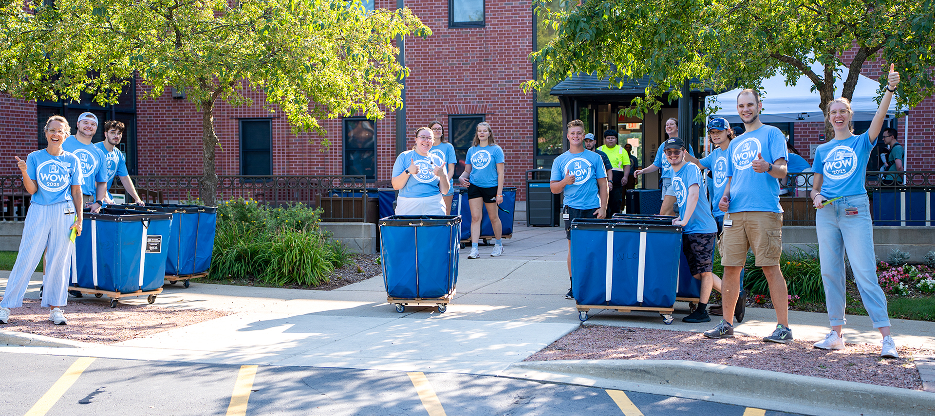 WOW Weekend volunteers outside a residence hall