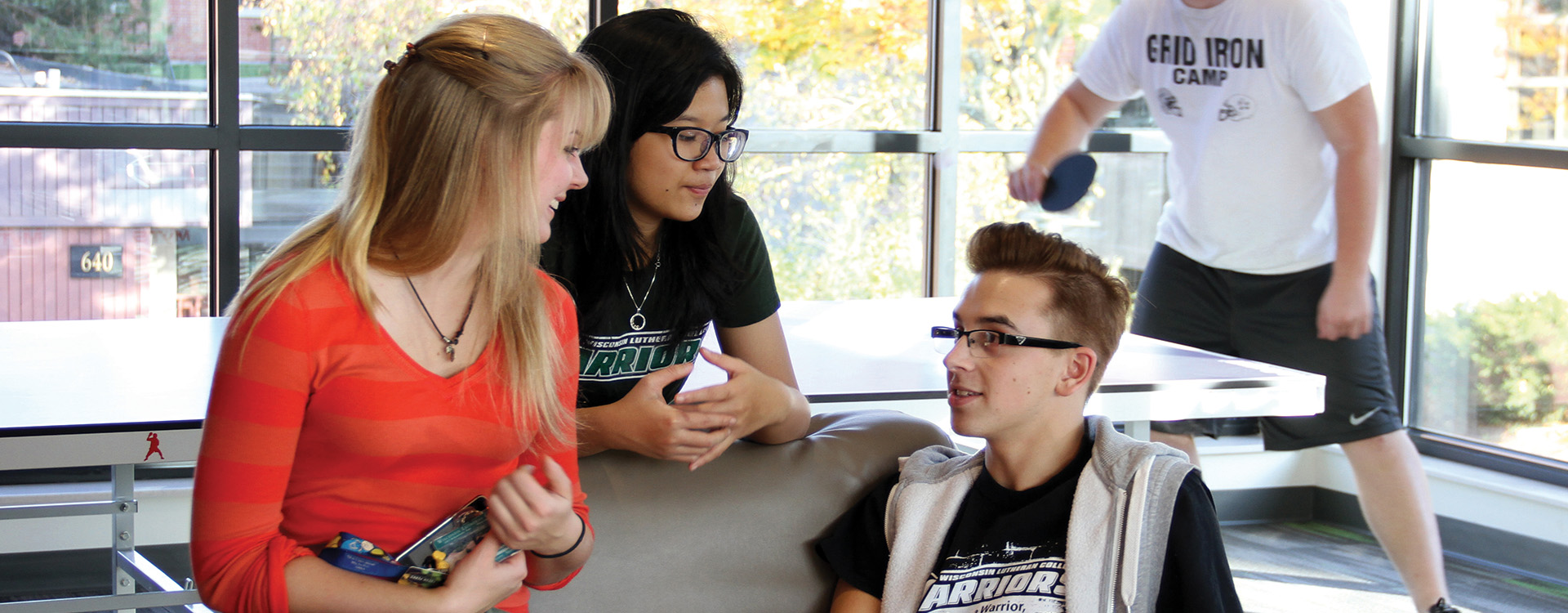 Students hanging out in Aspire Hall common area