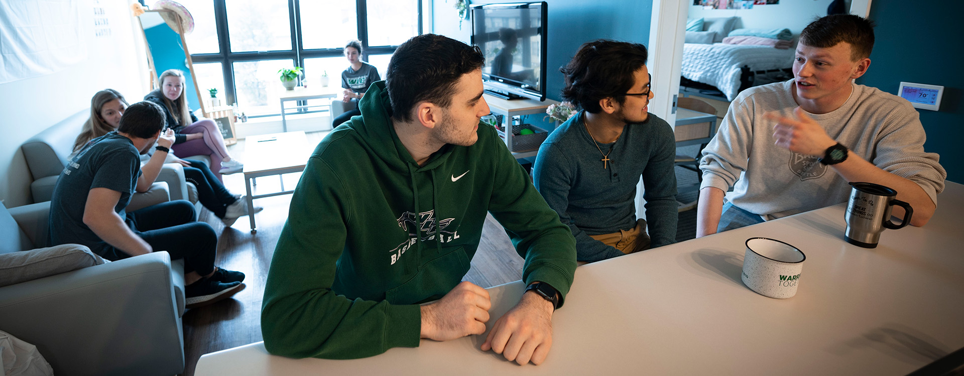 Students talking in apartment