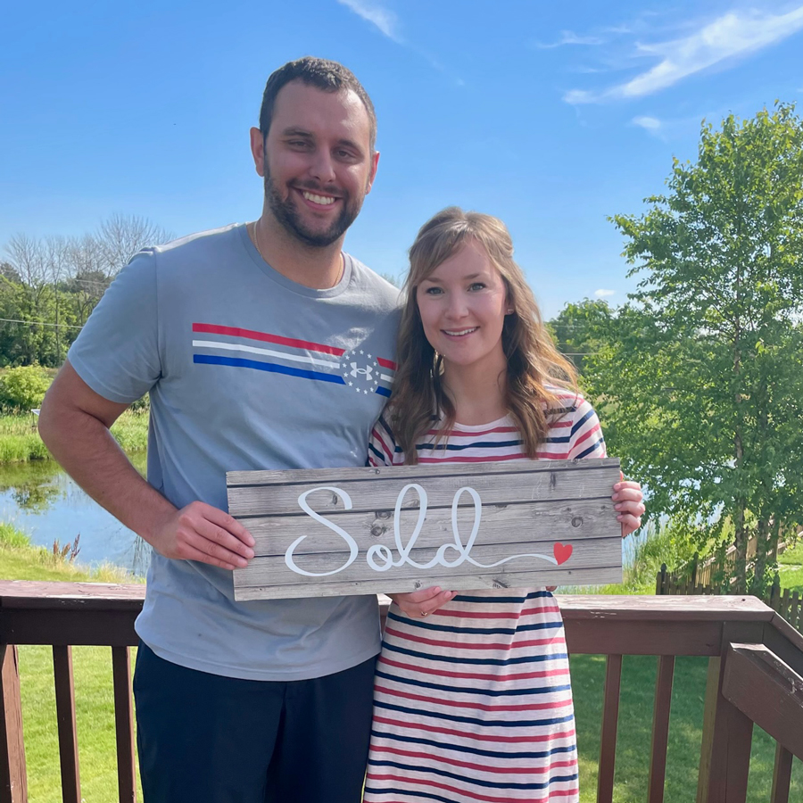 Katy and Matt with Sold sign