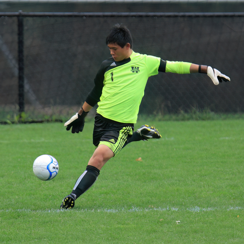 Matt Eisold kicking a soccer ball as goalkeeper