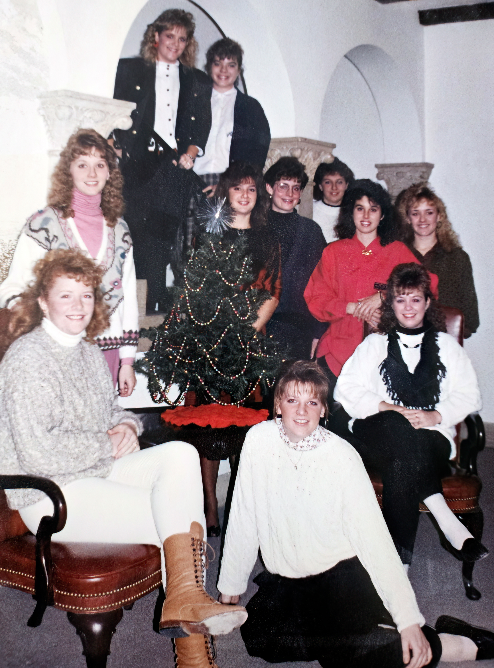 students posed around Christmas tree